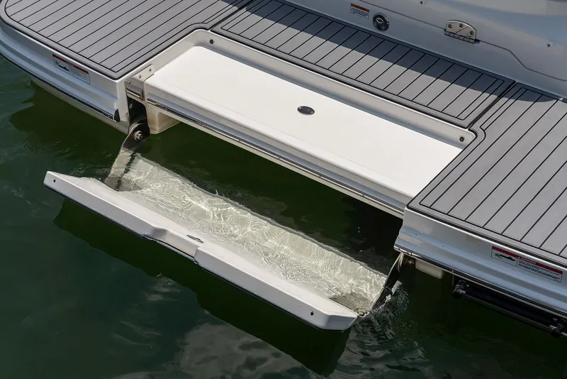 Slide: The Image of Manufacturer Provided Image: 2023 Sea Ray SDX 250 swim platform with integrated swim step in water. - 5