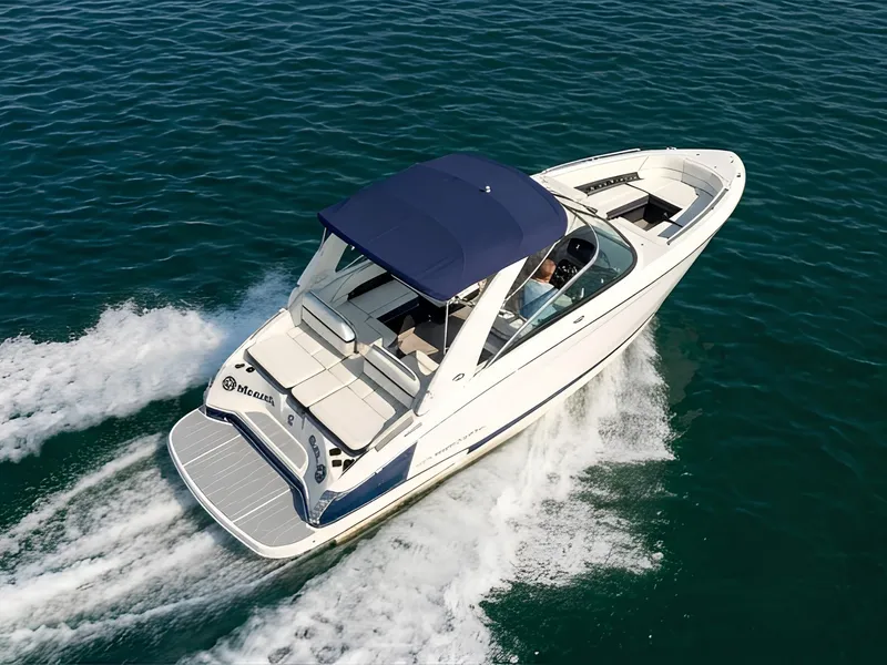 The Image of A 2019 Regal 2800 Bowrider speeds across the water. It features a blue sunshade. - 0