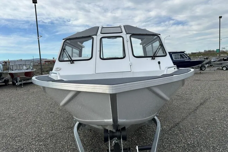 Slide: The Image of 2026 Weldcraft 220 Maverick boat on display in a parking lot. - 3