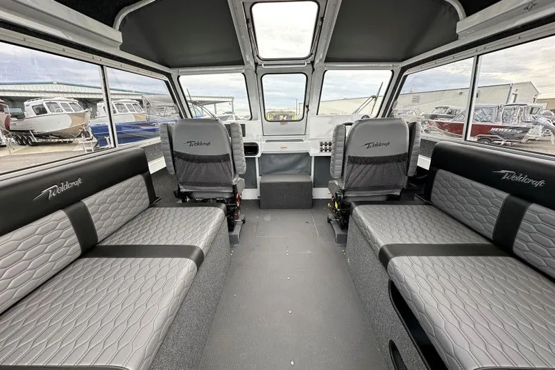 Slide: The Image of Interior of 2026 Weldcraft 220 Maverick boat with spacious seating and modern design. - 7