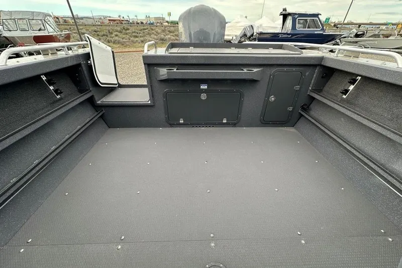 Slide: The Image of 2026 Weldcraft 220 Maverick boat interior with spacious deck and storage compartments. - 8