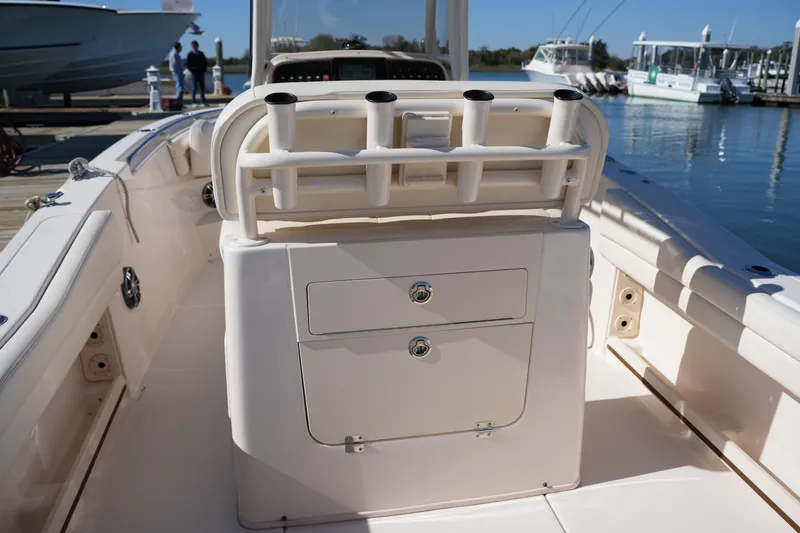 Slide: The Image of 2021 Grady-White Fisherman 236 boat interior with rod holders and storage compartments. - 14