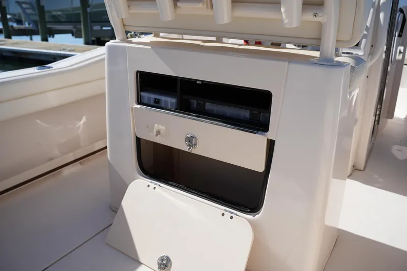 Slide: The Image of 2021 Grady-White Fisherman 236 boat storage compartment with open hatch and drawers. - 15
