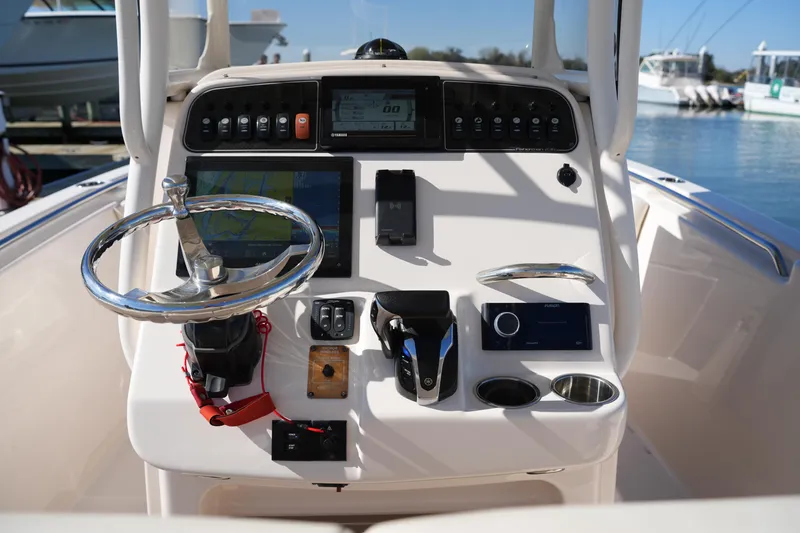 Slide: The Image of Grady-White Fisherman 236 console with steering wheel and navigation equipment, 2021 model. - 18