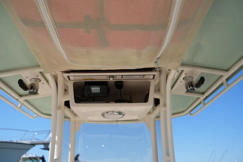 Slide: The Image of 2021 Grady-White Fisherman 236 boat console with storage and electronics under canopy. - 24