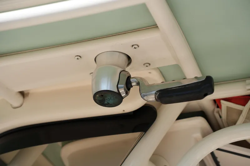 Slide: The Image of Close-up of a 2021 Grady-White Fisherman 236 boat handle mechanism. - 26