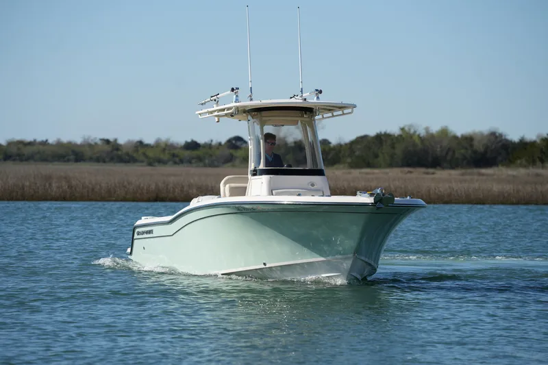 Slide: The Image of 2021 Grady-White Fisherman 236 boat cruising on a calm lake. - 3