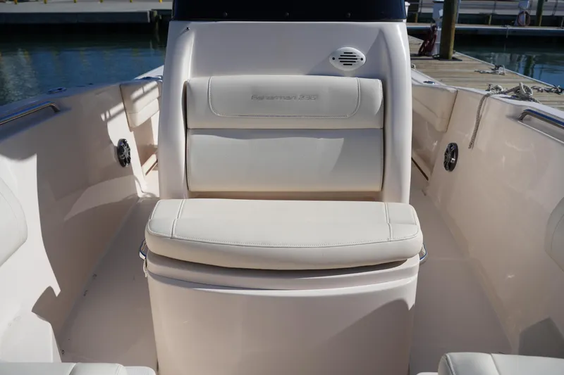 Slide: The Image of 2021 Grady-White Fisherman 236 boat interior with cushioned seating at the dock. - 31