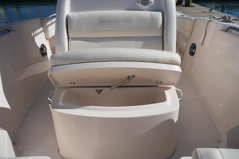 Slide: The Image of 2021 Grady-White Fisherman 236 boat seat with storage compartment open. - 32