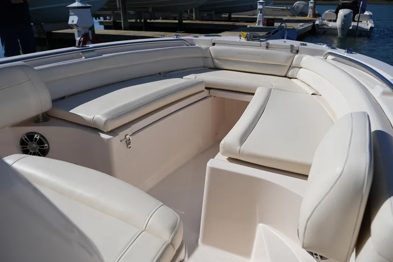 Slide: The Image of 2021 Grady-White Fisherman 236 boat interior with cushioned seating and speaker. - 33