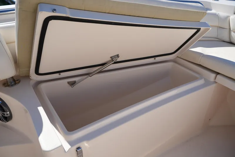 Slide: The Image of Open storage compartment on a 2021 Grady-White Fisherman 236 boat. - 35