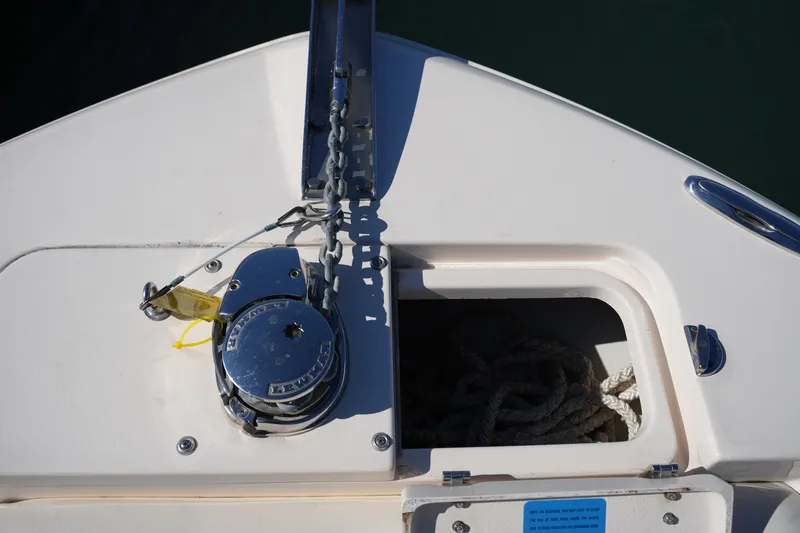 Slide: The Image of Bow of 2021 Grady-White Fisherman 236 with anchor chain and storage compartment. - 37
