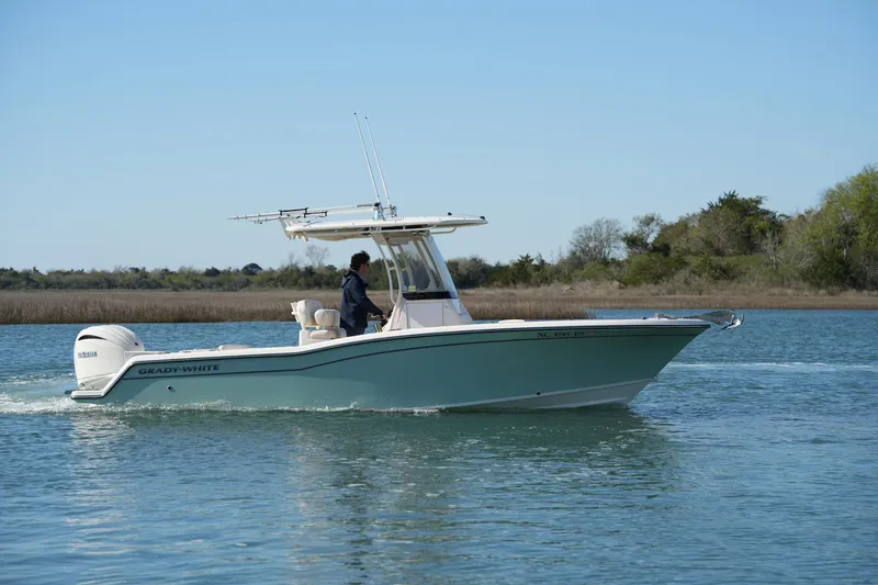 Slide: The Image of 2021 Grady-White Fisherman 236 boat cruising on a calm lake. - 4