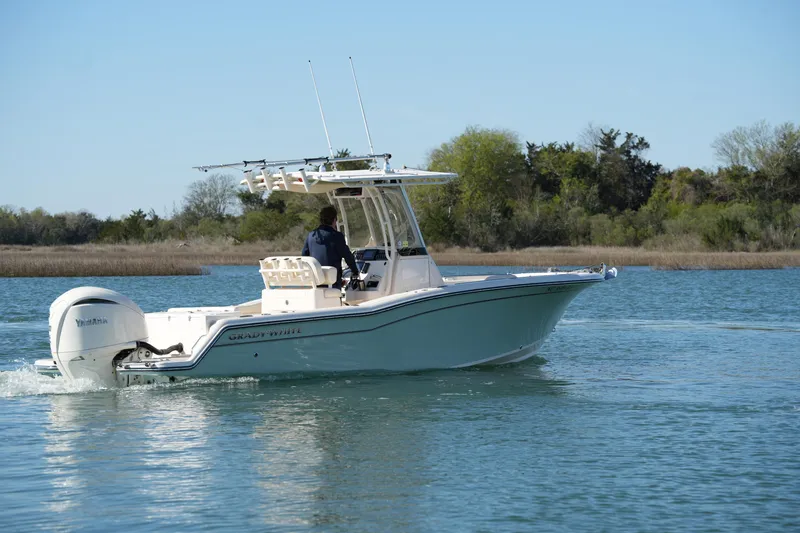 Slide: The Image of 2021 Grady-White Fisherman 236 boat cruising on a serene lake. - 5