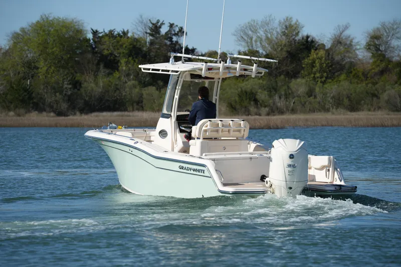 Slide: The Image of 2021 Grady-White Fisherman 236 boat cruising on a serene lake. - 8