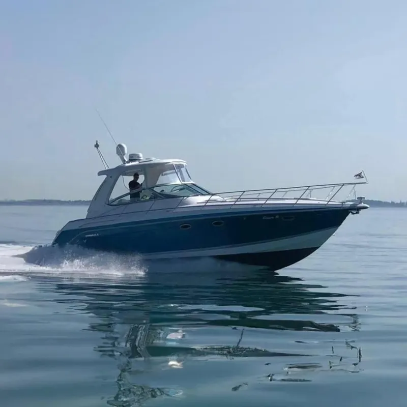 The Image of 2006 Formula 40 Performance Cruiser speeding on calm water. - 0