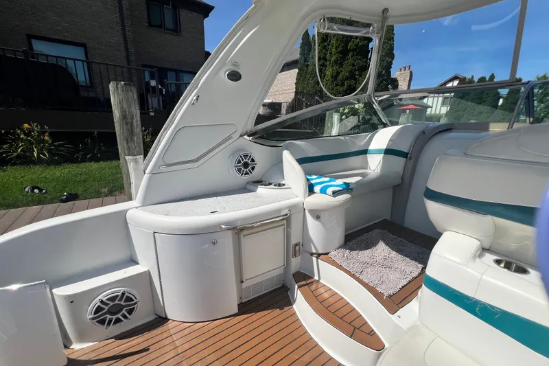 Slide: The Image of Interior of a 2006 Formula 40 Performance Cruiser with white seating and wood flooring. - 10