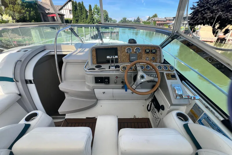 Slide: The Image of 2006 Formula 40 Performance Cruiser cockpit with steering wheel and control panel. - 12