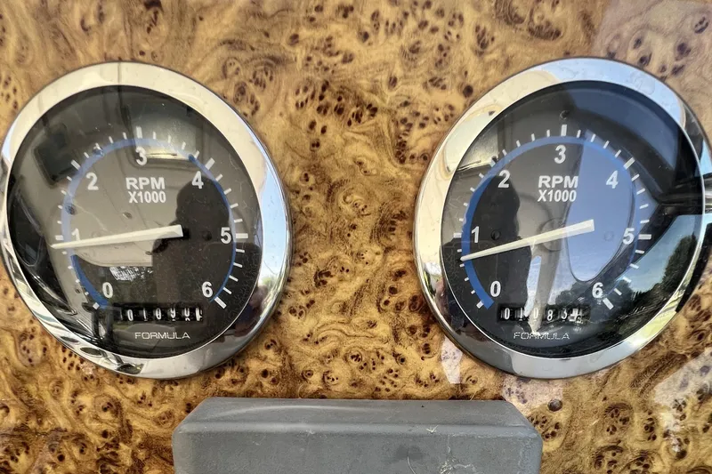 Slide: The Image of Dashboard of a 2006 Formula 40 Performance Cruiser with dual RPM gauges. - 14