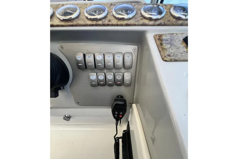 Slide: The Image of Control panel of a 2006 Formula 40 Performance Cruiser with switches and gauges. - 15