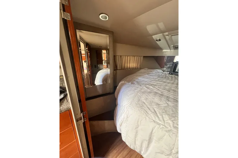 Slide: The Image of Interior of 2006 Formula 40 Performance Cruiser with cozy bed and wooden accents. - 21