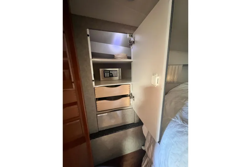 Slide: The Image of Interior of 2006 Formula 40 Performance Cruiser with open cabinet and safe. - 22