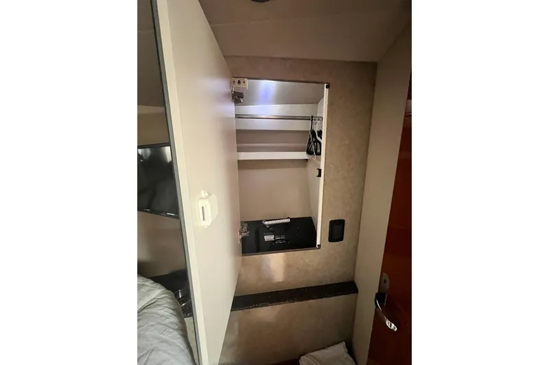 Slide: The Image of Interior closet of 2006 Formula 40 Performance Cruiser with open door and safe. - 23