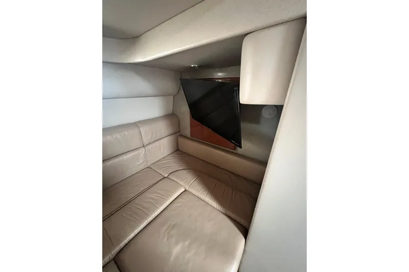 Slide: The Image of Interior of 2006 Formula 40 Performance Cruiser with beige leather seating and mounted TV. - 28