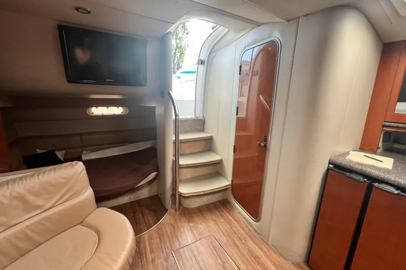 Slide: The Image of Interior of 2006 Formula 40 Performance Cruiser with stairs, seating, and TV. - 31