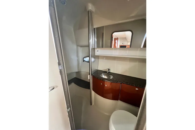 Slide: The Image of 2006 Formula 40 Performance Cruiser bathroom with sink, mirror, and storage cabinets. - 33
