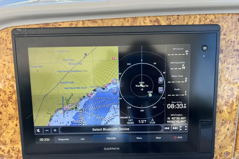 Slide: The Image of Garmin navigation display on 2006 Formula 40 Performance Cruiser showing map and GPS data. - 35