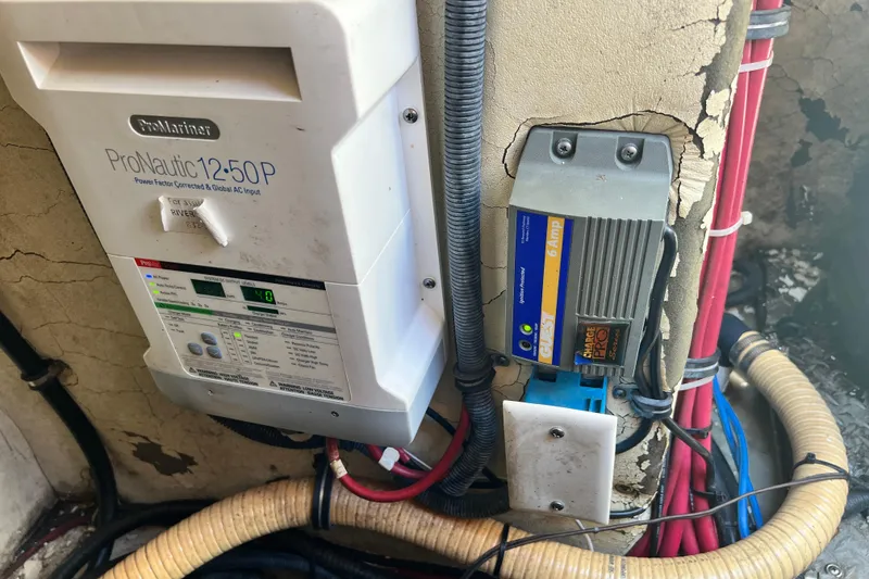 Slide: The Image of Electrical components in a 2006 Formula 40 Performance Cruiser, featuring ProMariner ProNautic charger. - 43