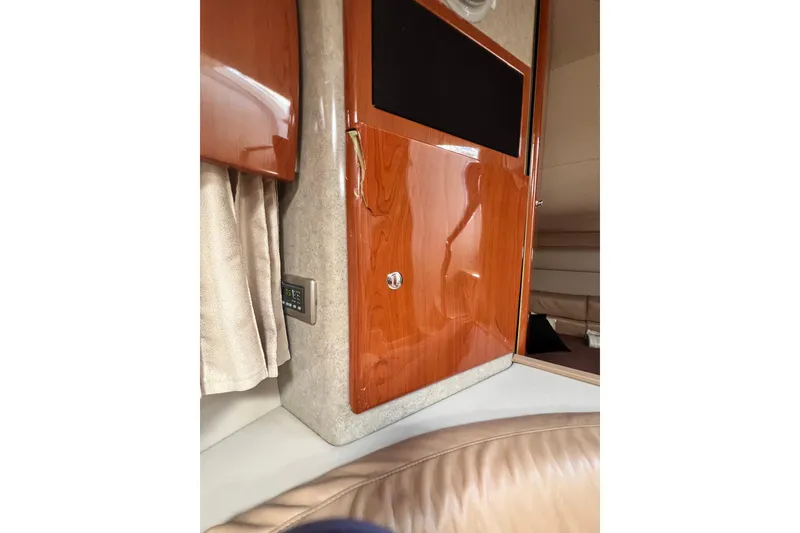 Slide: The Image of Interior of 2006 Formula 40 Performance Cruiser with wood paneling and beige upholstery. - 47