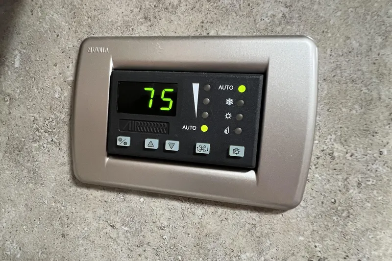 Slide: The Image of Thermostat control panel on 2006 Formula 40 Performance Cruiser, displaying 75 degrees. - 48