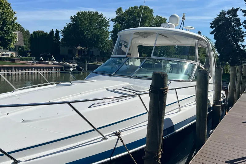 Slide: The Image of 2006 Formula 40 Performance Cruiser docked at a marina on a sunny day. - 53