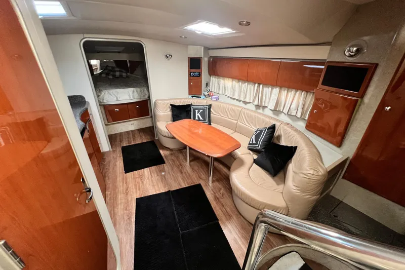 Slide: The Image of Luxurious interior of a 2006 Formula 40 Performance Cruiser with leather seating and wood accents. - 55