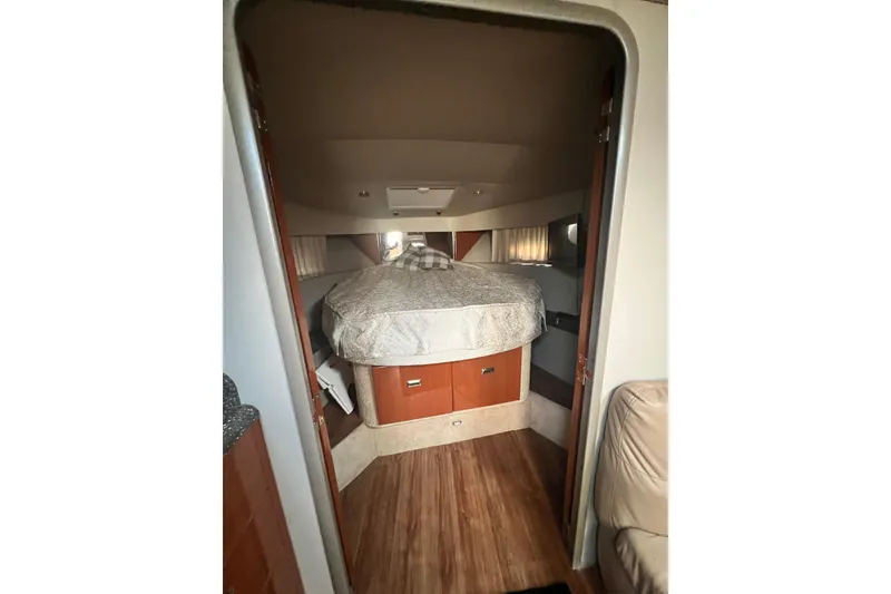 Slide: The Image of Interior cabin of a 2006 Formula 40 Performance Cruiser with cozy bed and wood accents. - 57