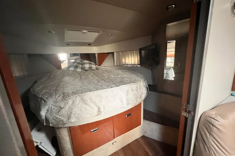 Slide: The Image of Interior cabin of a 2006 Formula 40 Performance Cruiser with bed and TV. - 58