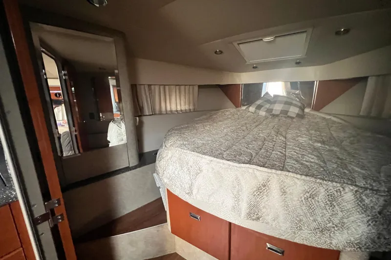 Slide: The Image of Interior cabin of a 2006 Formula 40 Performance Cruiser with a cozy bed setup. - 59