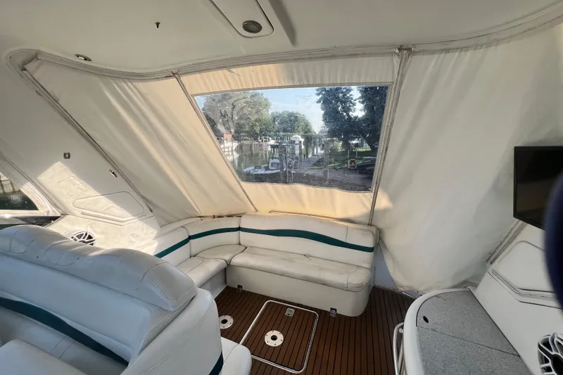 Slide: The Image of Interior of a 2006 Formula 40 Performance Cruiser with white seating and wood flooring. - 62