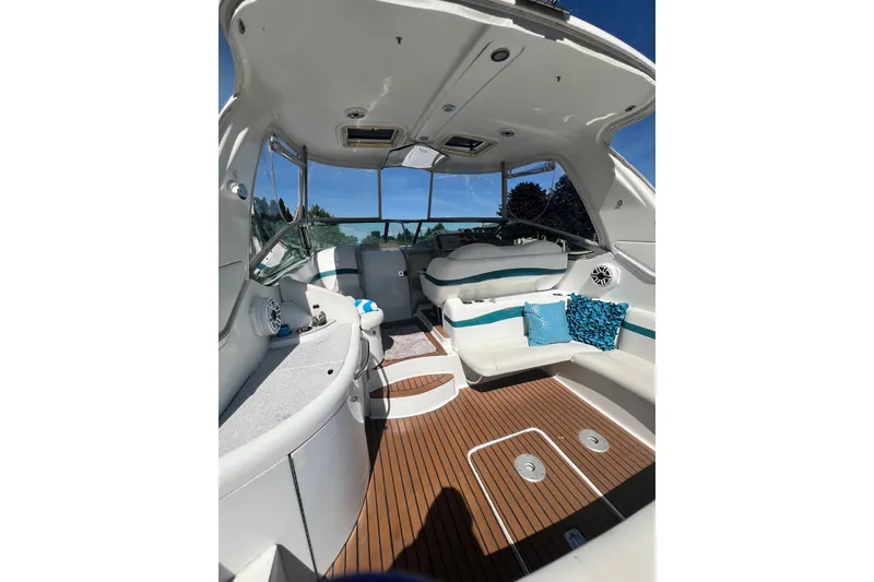 Slide: The Image of Interior of a 2006 Formula 40 Performance Cruiser with white seating and wood flooring. - 9