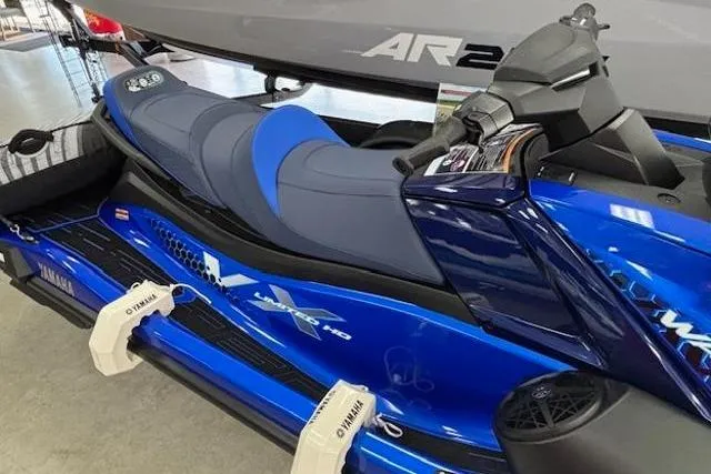 Slide: The Image of 2026 Yamaha WaveRunner VX Limited HO in vibrant blue, displayed indoors. - 4