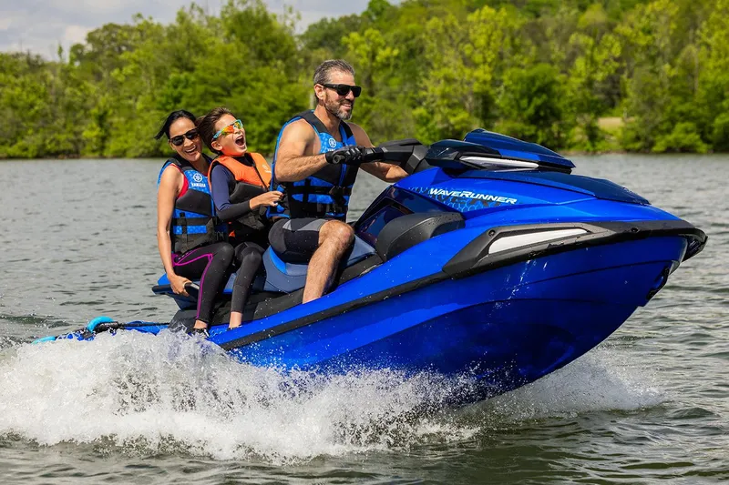 Slide: The Image of Manufacturer Provided Image: 2026 Yamaha WaveRunner VX Limited HO with three riders enjoying a lake adventure. - 9