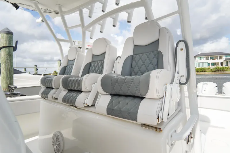 Slide: The Image of Luxury seating on 2022 SeaHunter 41 CTS boat, featuring plush, diamond-stitched upholstery. - 17