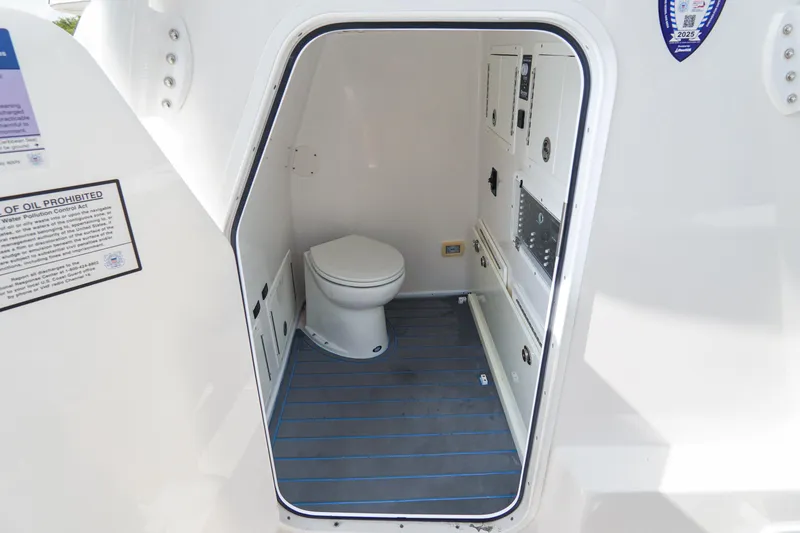 Slide: The Image of 2022 SeaHunter 41 CTS boat interior with compact marine toilet. - 21
