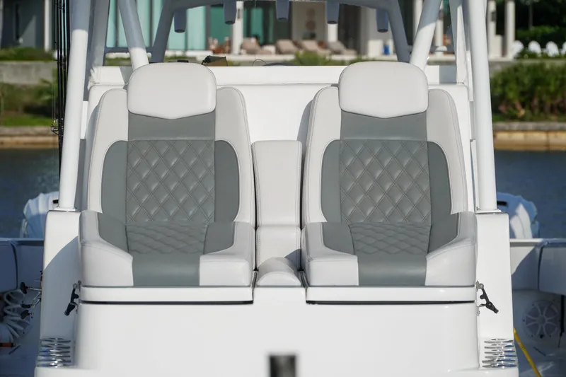 Slide: The Image of Luxury seating on 2022 SeaHunter 41 CTS boat, featuring elegant gray and white upholstery. - 24