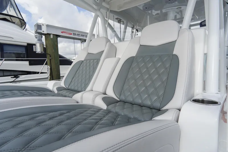Slide: The Image of Luxurious seating on 2022 SeaHunter 41 CTS boat, featuring diamond-stitched upholstery. - 25