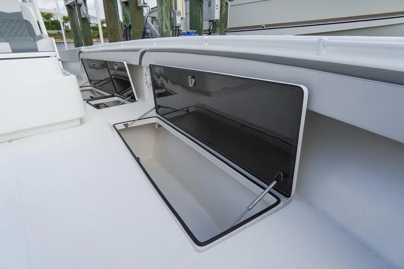 Slide: The Image of 2022 SeaHunter 41 CTS boat storage compartments open on deck. - 34