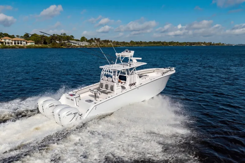 Slide: The Image of 2022 SeaHunter 41 CTS boat cruising on a sunny day with powerful engines. - 8