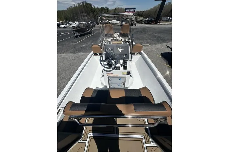 Slide: The Image of 2026 Xpress XR21 Bay boat interior with steering console and seating. - 17